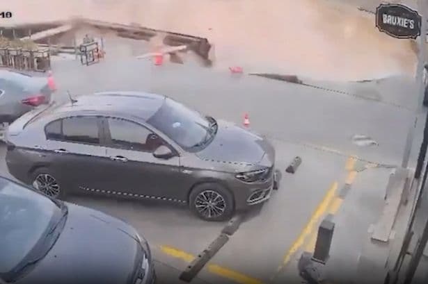 Incredible moment sinkhole swallows ENTIRE petrol station as drivers flee
