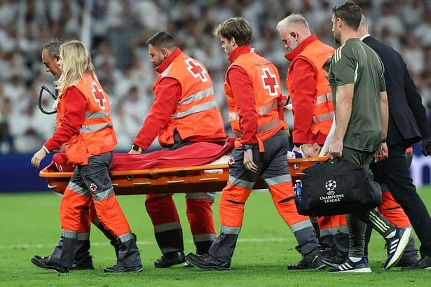 Real Madrid star leaves pitch on a stretcher and in neck brace after horror clash